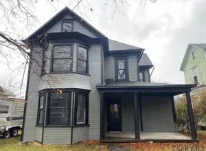 Photo of Spacious Home with Covered Front Porch, Rear Deck, Hardwood Floors, and Separate Dining Room – $44,900