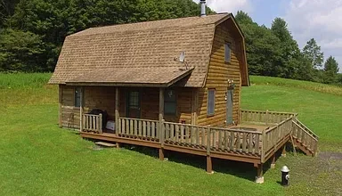 Photo of Serene Mountaintop Log Cabin on 68+ Acres – A True Sportsman’s Paradise