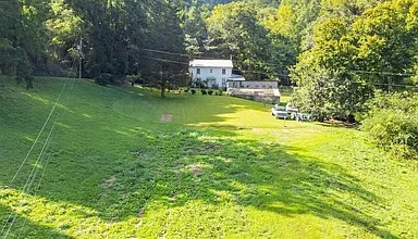 Photo of $249,500 – Historic 4-Bedroom Farmhouse on 17 Acres with Pond in Sneedville, TN