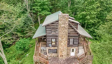 Photo of $299,000 – 2-Bedroom Log Cabin on 3.54 Acres with Mountain Views in Mountain City, TN