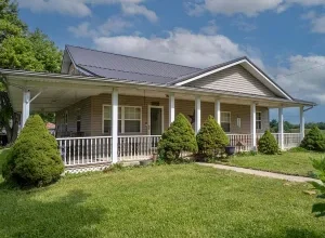 Photo of $240,000 – 4-Bedroom Farmhouse with Barns on 75 Acres in Olive Hill, KY